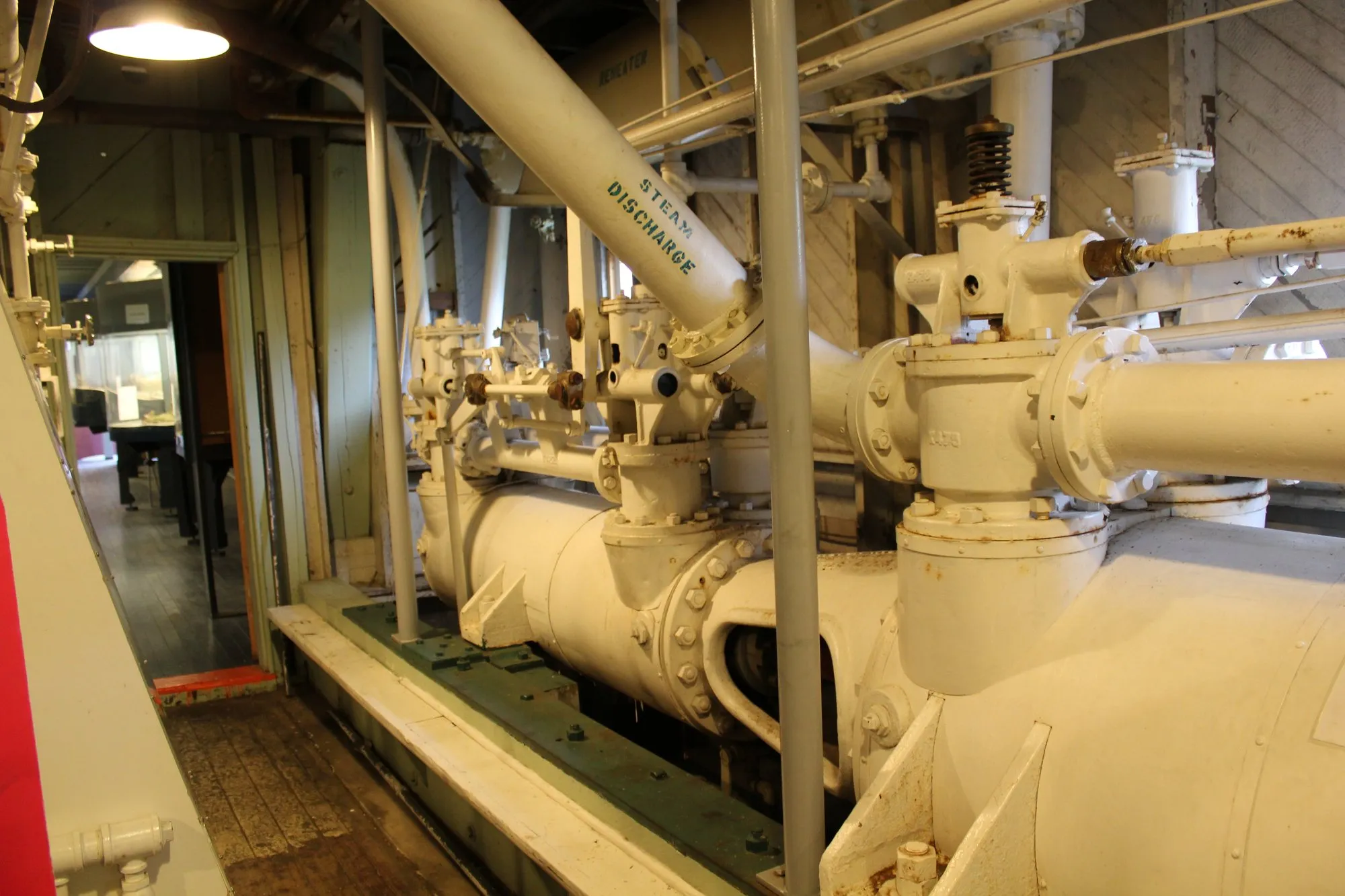 One of the two engines from the forward end, with its valve chest and the pipe stencilled Steam Discharge