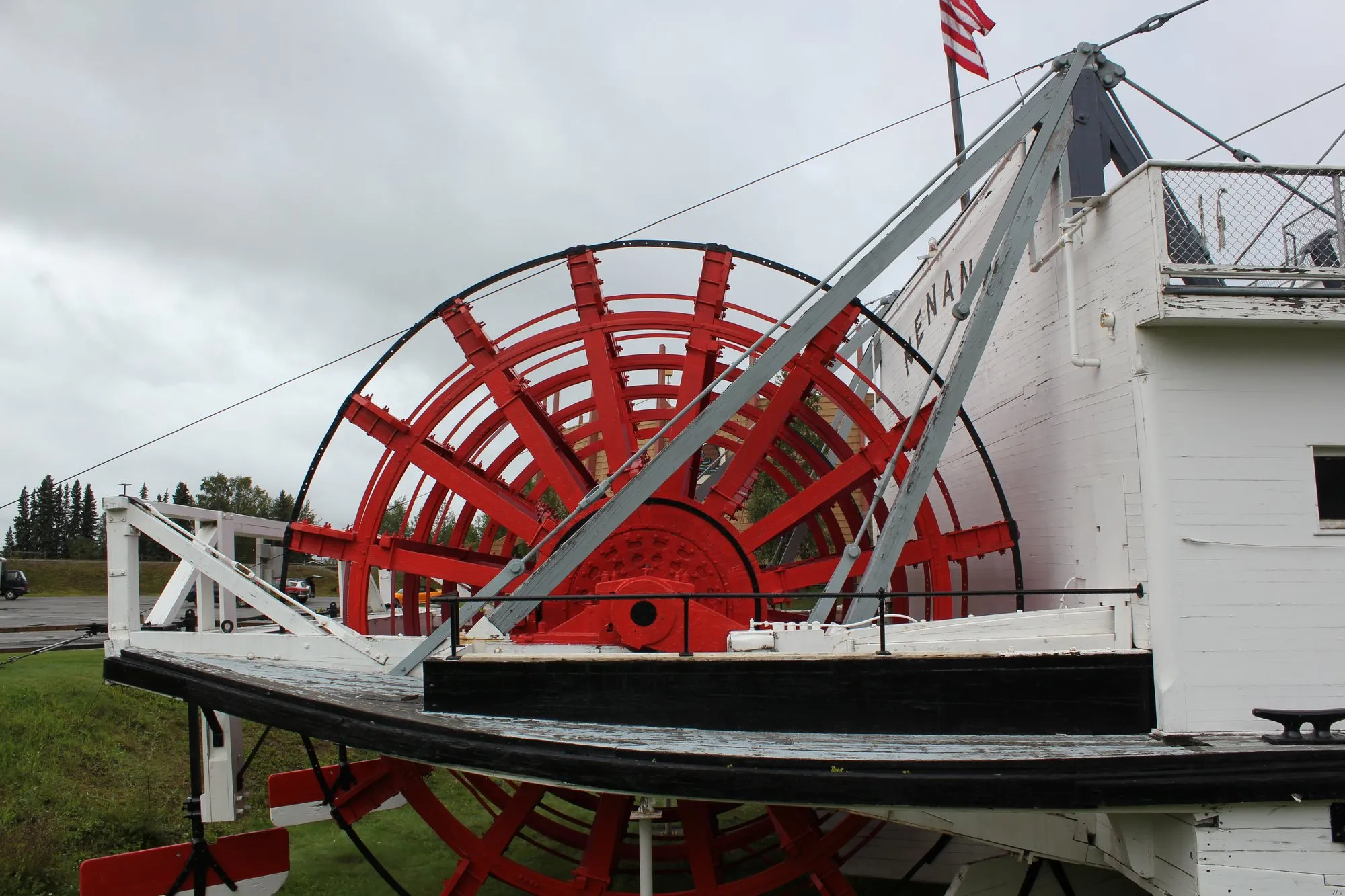 The red sternwheel and its white framing at the stern