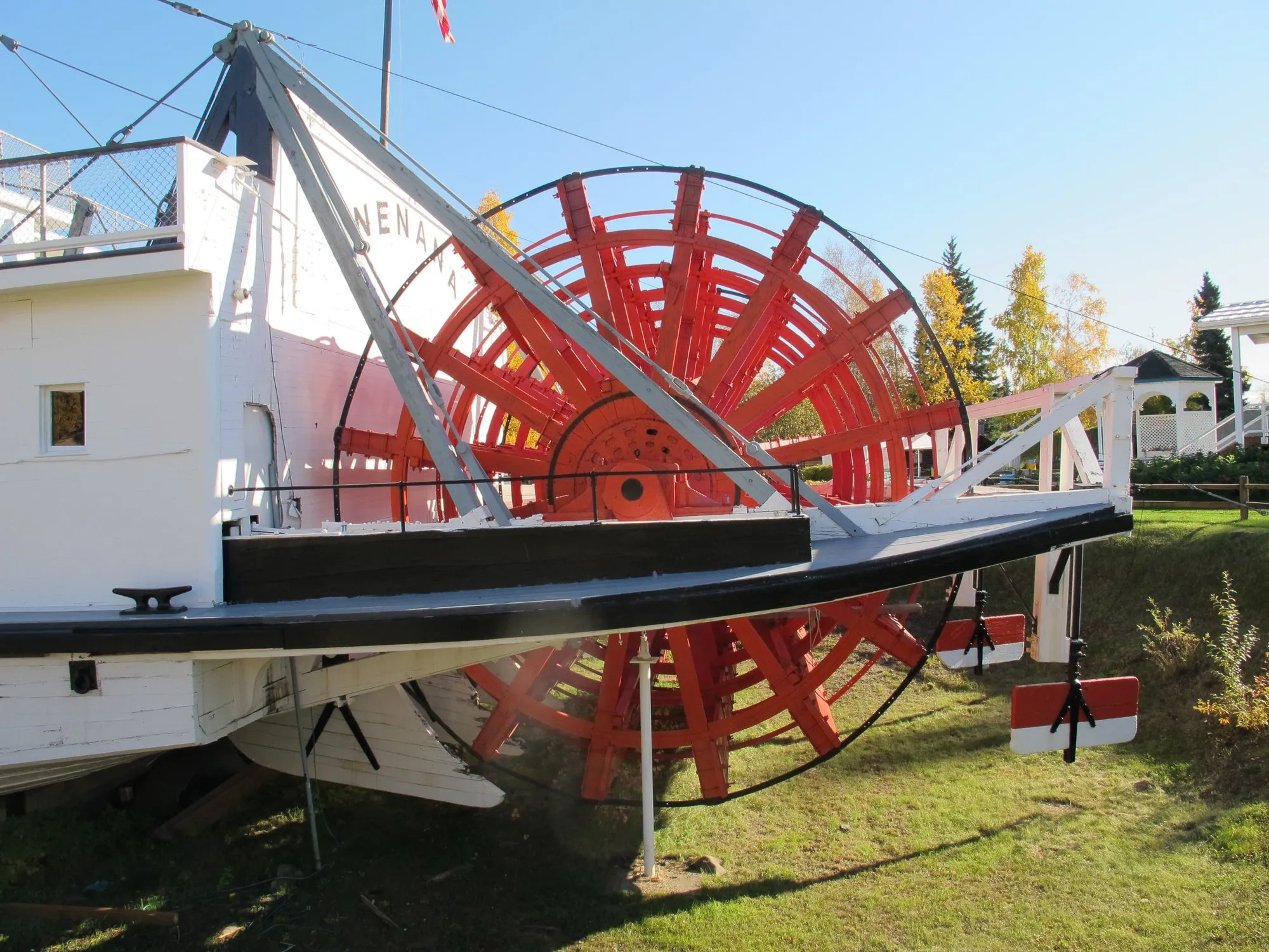 Red sternwheel seen from the quarter in bright autumn sun