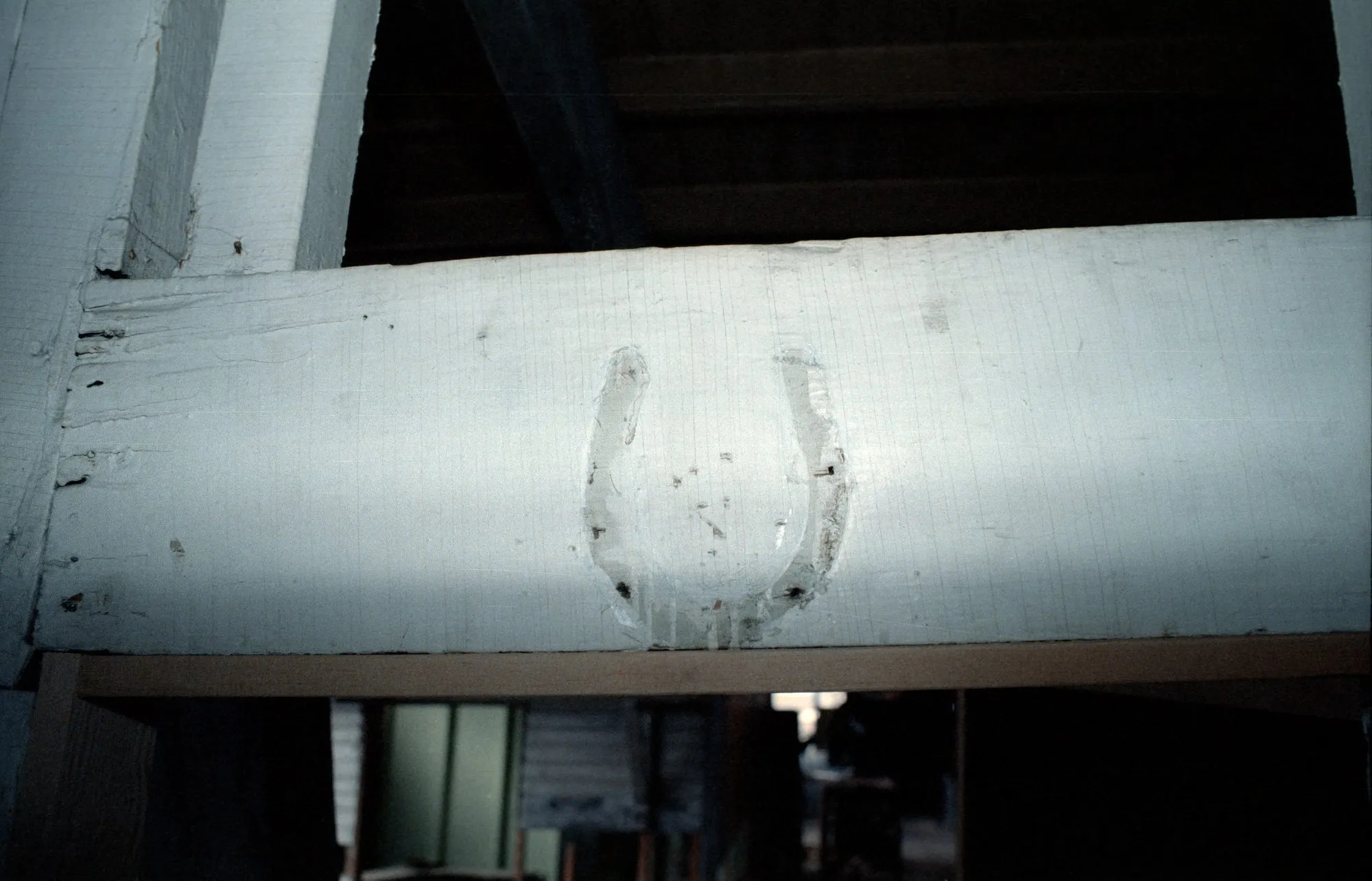 Horseshoe fixed to a beam